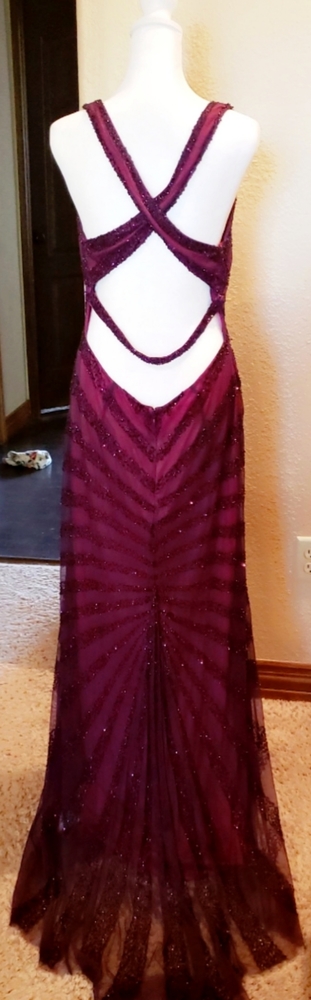 Beautiful beaded floor length dress. Tag reads size 12 but fits like a 6-8.